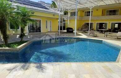 Imagem: A casa em condomínio possui 5 Dormitórios, 5 Banheiros, 4