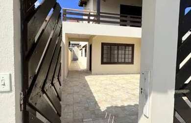 Imagem: A casa possui 3 Dormitórios, 3 Banheiros, 3 Vagas na garagem