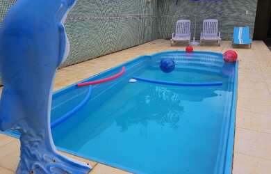 Imagem: A casa e possui 3 Dormitórios, Suítes, Banheiros, 3 Vagas