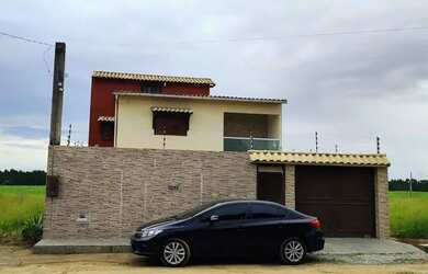 Imagem: A casa possui 3 Dormitórios, 3 Banheiros, 3 Vagas na garagem