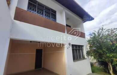 Imagem: A casa possui 3 Dormitórios, 2 Banheiros, 2 Vagas na garagem