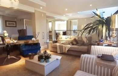 Imagem: A casa possui 4 Dormitórios, 4 Banheiros, 4 Vagas na garagem