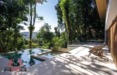 Imagem: A casa possui 4 Dormitórios, 5 Banheiros, 4 Vagas na garagem