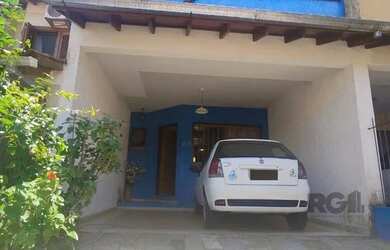 Imagem: A casa possui 3 Dormitórios, 3 Banheiros, 2 Vagas na garagem