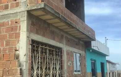 Imagem: A casa possui 2 Dormitórios, 2 Banheiros e 70m² de Área e