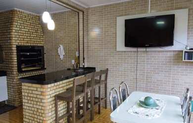 Imagem: A casa possui 3 Dormitórios, 3 Banheiros, 3 Vagas na garagem