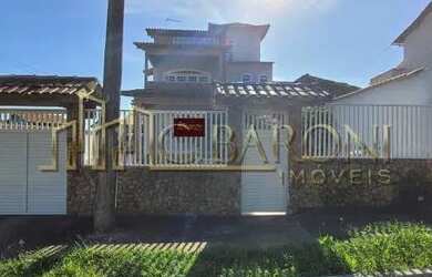 Imagem: A casa possui 3 Dormitórios, 4 Banheiros, 4 Vagas na garagem