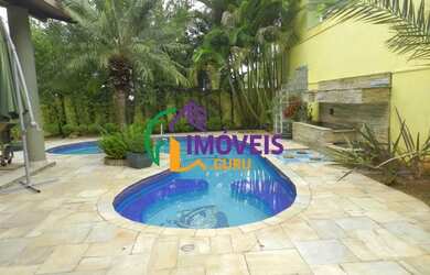 Imagem: A casa em condomínio possui 5 Dormitórios, 1 Banheiro, 4 Vagas