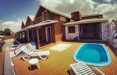 Imagem: A casa possui 5 Dormitórios, 1 Banheiro, 1 Vaga na garagem