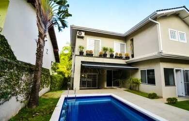 Imagem: A casa possui 4 Dormitórios, 5 Banheiros, 5 Vagas na garagem