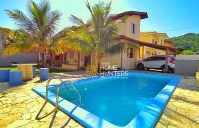 Imagem: A casa possui 2 Dormitórios, 2 Banheiros, 2 Vagas na garagem