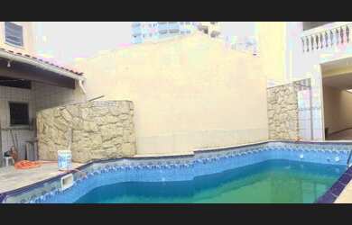 Imagem: A casa possui 4 Dormitórios, 3 Vagas na garagem e está localizado