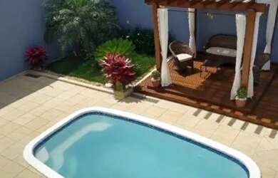 Imagem: A casa possui 3 Dormitórios, 4 Banheiros, 4 Vagas na garagem