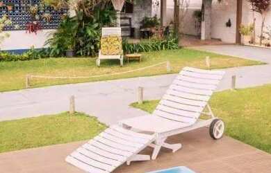 Imagem: A casa possui 5 Dormitórios, Acomodam 12 pessoas, 3 Vagas na