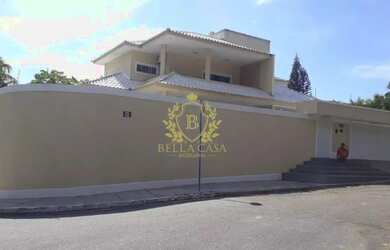 Imagem: A casa possui 4 Dormitórios, 5 Banheiros, 4 Vagas na garagem