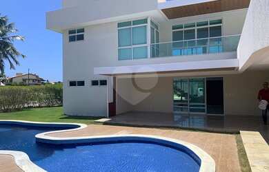 Imagem: A casa possui 4 Dormitórios, 5 Banheiros, 5 Vagas na garagem