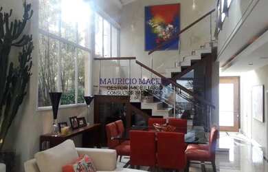 Imagem: A casa possui 4 Dormitórios, 5 Banheiros, 5 Vagas na garagem