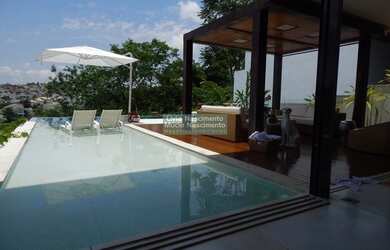 Imagem: A casa em condomínio possui 4 Dormitórios, 5 Banheiros, 4