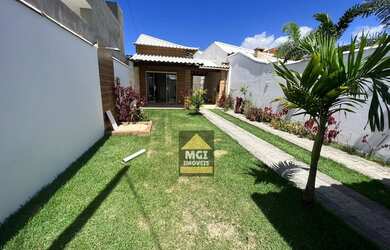 Imagem: A casa e possui 2 Dormitórios, Suítes, 3 Banheiros, 5 Vagas