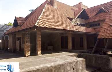 Imagem: A casa possui 5 Dormitórios, 5 Banheiros, 5 Vagas na garagem