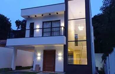 Imagem: A casa possui 3 Dormitórios, 3 Banheiros, 2 Vagas na garagem