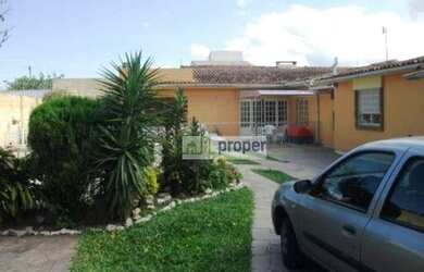 Imagem: A casa possui 4 Dormitórios, 2 Banheiros, 3 Vagas na garagem