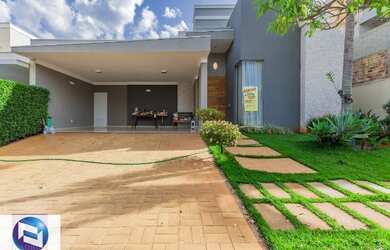 Imagem: A casa possui 3 Dormitórios, 5 Banheiros, 4 Vagas na garagem