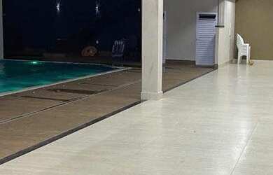 Imagem: A casa possui 3 Dormitórios, 5 Banheiros, 5 Vagas na garagem