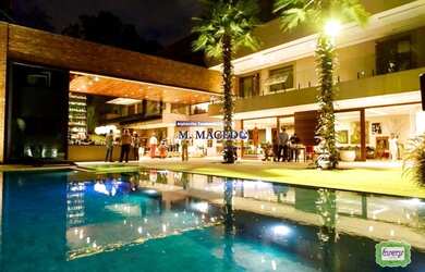 Imagem: A casa possui 4 Dormitórios, 5 Banheiros, 5 Vagas na garagem