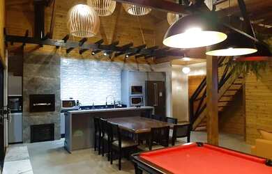 Imagem: A casa possui 3 Dormitórios, 3 Vagas na garagem e está localizado