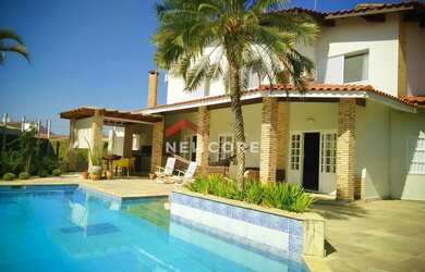 Imagem: A casa possui 5 Dormitórios, 5 Banheiros, 5 Vagas na garagem