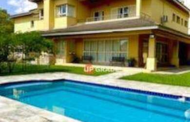 Imagem: A casa em condomínio possui 5 Dormitórios, 5 Banheiros, 5