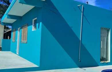 Imagem: A casa possui 4 Dormitórios, 3 Banheiros, 4 Vagas na garagem