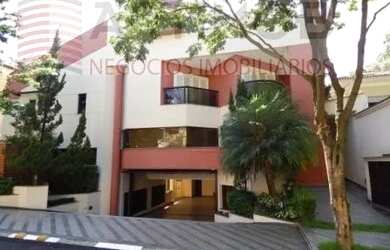 Imagem: A casa possui 4 Dormitórios, 5 Banheiros, 5 Vagas na garagem