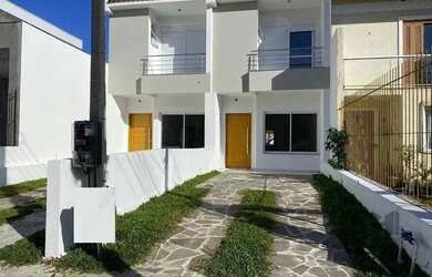 Imagem: A casa possui 3 Dormitórios, 3 Banheiros, 2 Vagas na garagem