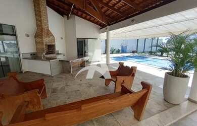 Imagem: A casa possui 3 Dormitórios, 5 Banheiros, 4 Vagas na garagem