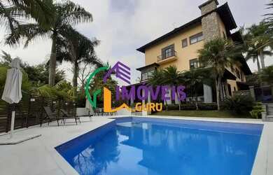 Imagem: A casa em condomínio possui 4 Dormitórios, 5 Banheiros, 5