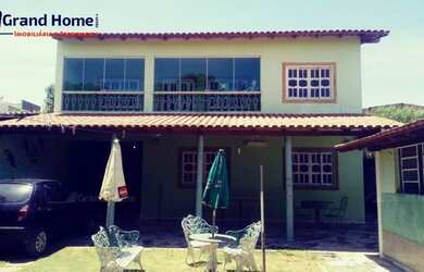 Imagem: A casa possui 4 Dormitórios, 2 Banheiros, 5 Vagas na garagem