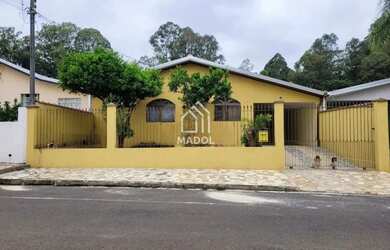 Imagem: A casa possui 3 Dormitórios, 2 Banheiros, 1 Vaga na garagem