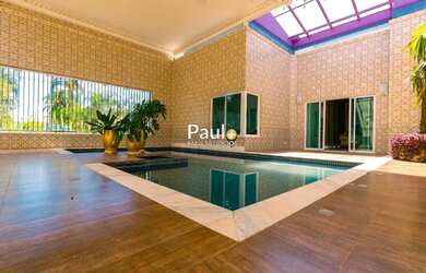 Imagem: A casa em condomínio possui 5 Dormitórios, 5 Banheiros, 5