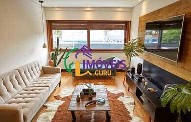 Imagem: A casa possui 4 Dormitórios, 4 Banheiros, 5 Vagas na garagem