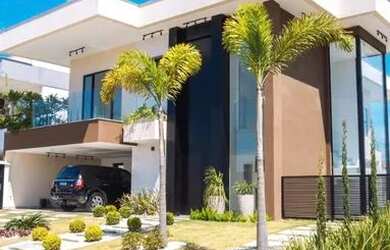 Imagem: A casa possui 3 Dormitórios, 5 Banheiros, 4 Vagas na garagem