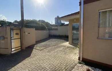 Imagem: A casa em condomínio possui 4 Dormitórios, 3 Banheiros, 2