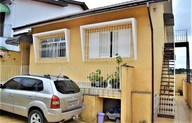 Imagem: A casa possui 3 Dormitórios, 3 Banheiros, 3 Vagas na garagem