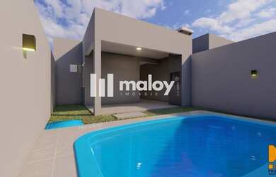 Imagem: A casa possui 3 Dormitórios, 3 Banheiros, 2 Vagas na garagem