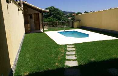 Imagem: A casa possui 2 Dormitórios, 2 Vagas na garagem e está localizado