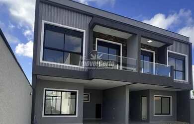 Imagem: A casa possui 3 Dormitórios, 3 Banheiros, 2 Vagas na garagem