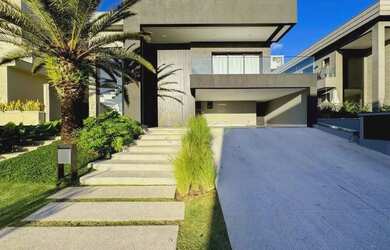 Imagem: A casa possui 5 Dormitórios, 5 Banheiros, 4 Vagas na garagem