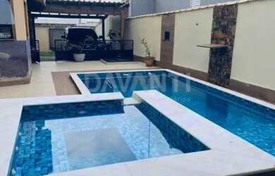 Imagem: A casa possui 4 Dormitórios, 4 Banheiros, 4 Vagas na garagem