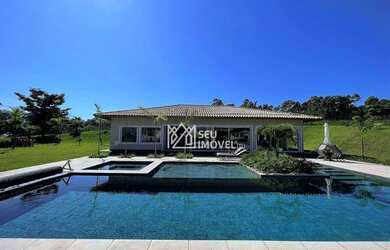 Imagem: A casa em condomínio possui 5 Dormitórios, 5 Banheiros, 5